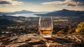 malt whisky in a whisky glass, in the background a Scottish landscape