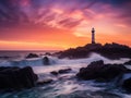 Lighthouse Silhouette at Dusk on a Rocky Coastline Royalty Free Stock Photo