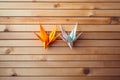 Vibrant Origami Cranes in Mid-Flight on Marble Surface