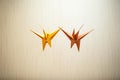 Vibrant Origami Cranes in Mid-Flight - Abstract Rivalry