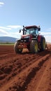 Dynamic Red Tractor Ploughing Rich Brown Soil Field Royalty Free Stock Photo