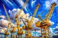 Powerful Mobile and Tower Cranes at a Construction Site Under a Sunny Sky A Majestic Image of Infrastructure Royalty Free Stock Photo