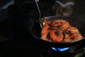 Sizzling Shrimp on a Blue Flame Stove