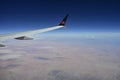 Wings Above the Clouds: A Glimpse of Blue Sky