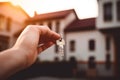 Real estate agent holding house key in hand. Real estate concept. Ai generative Royalty Free Stock Photo