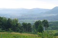 A captivating rural scene unfolds in the morning light at the foothills, where lush greenery meets a gentle mist Royalty Free Stock Photo