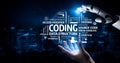 Futuristic robotic hand interacting with digital coding symbols representing technology, programming, and innovation in Royalty Free Stock Photo