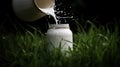 Captivating shot of a milk canister with a graceful stream of fresh milk pouring out against a clean background