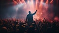 A captivating snapshot capturing the vibrant atmosphere of a concert, bunch of excited fans, illuminated by colorful stage lights Royalty Free Stock Photo