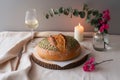 A Still Life Featuring Artisan Bread, Wine, and Delicate Floral Arrangements Royalty Free Stock Photo