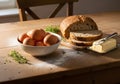 Rustic Breakfast Still Life with Eggs Bread and Butter on Wooden Tabletop in Natural Light Royalty Free Stock Photo