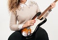 Elegant Melodies: Young Woman Showcasing Her Guitar Skills