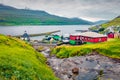 Captivating summer view of Haldarsvik village with Haldorsvikar Church.