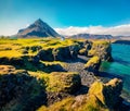 Captivating summer view of small fishing village at the foot of Mt. Stapafell - Arnarstapi or Stapi. Impressive morning scene of I