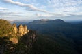 Captivating Sunset View: Tourists Overlook Canyon and Valley. At a lookout at the three sisters in the blue mountains Royalty Free Stock Photo