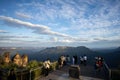 Captivating Sunset View: Tourists Overlook Canyon and Valley. At a lookout at the three sisters in the blue mountains