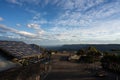 Captivating Sunset View: Tourists Overlook Canyon and Valley. At a lookout at the three sisters in the blue mountains Royalty Free Stock Photo