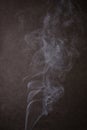 Abstract Smoke Dance against Dark Textured Background