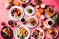 A captivating top-angle photograph capturing a fancy breakfast spread arranged on a stylish table with a chic pink background. The