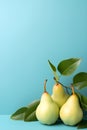 Green pears on blue background, empty copy space, Vertical format 2:3 Royalty Free Stock Photo