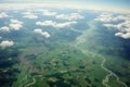 A captivating view clouds and green fields from a plane