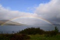 Captivating view of a full rainbow in the waters in Scotland