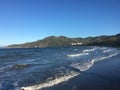 Captivating view of the sunny ocean and lush green mountains of Costa Rica