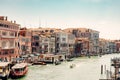 Captivating view of Venice\'s Grand Canal: beautifully colored buildings, boats, and gondolas