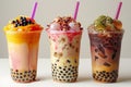 Captivating visual featuring three boba teas in different colors, one with orange milk and black pearls on top, the second ha Royalty Free Stock Photo