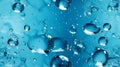 Capture abstract shapes formed by frozen motion of water bubbles on a blue backdrop Royalty Free Stock Photo