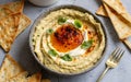 Capture the essence of Baba Ghanoush in a mouthwatering food photography shot