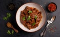 Capture the essence of Beef Rendang in a mouthwatering food photography shot