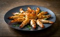 Capture the essence of Gambas Al Ajillio in a mouthwatering food photography shot