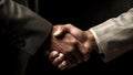 Handshake of two businessmen on a black background. Close-up. Generative AI. Royalty Free Stock Photo