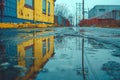 Urban Cityscape Rainy Day in the City Street with Puddle and Building Reflection in Water Royalty Free Stock Photo