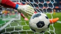 Capture the exact moment a soccer ball curves into the net, with the goalie's outstretched hands blurred in the Royalty Free Stock Photo