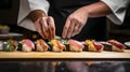 Person Cutting Up Sushi on Cutting Board, Step-by-Step Guide to Making Delicious Sushi at Home Royalty Free Stock Photo