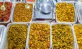 Photo of a variety of Indian pickle in the plastic boxes for sale in Indian shop
