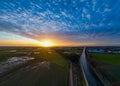 Dramatic Sunset Aerial View over Country Road and Fields Royalty Free Stock Photo