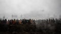 Captured by enemy concept. Military silhouettes and crowd on war fog sky background. World War Soldiers and armored vehicles