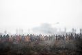 Captured by enemy concept. Military silhouettes and crowd on war fog sky background. World War Soldiers and armored vehicles