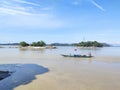 Captured far image of an Umananda Temple & a boat with fisherman