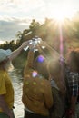 Friends Cheering with Water Bottles