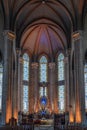 Vertical Glimpse of Saint Antoine Church: Crucifix, Stained Glass, and Domes Royalty Free Stock Photo