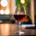 Velvet Sip: A Glass of Red in Ambient Light Royalty Free Stock Photo