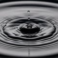Captures the precise moment of a droplet impacting the surface, Royalty Free Stock Photo