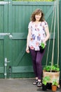 Adele beside her recently planted runner beans. Royalty Free Stock Photo