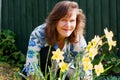 Adele amongst the sunlight and a host of golden daffodils.