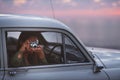 Capturing beautiful view. a young woman taking pictures while out on a road trip. Royalty Free Stock Photo