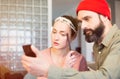 Capturing bright moments. Beautiful young loving couple bonding to each other and making selfie while sitting on the Royalty Free Stock Photo